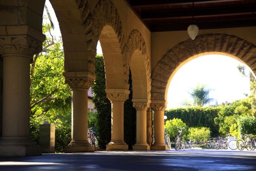 Long corridor at Stanford California. Amber sculpted stones columns