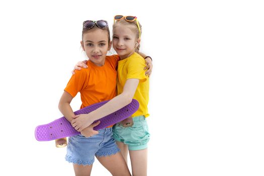 Two teenage girls with skateboard over white