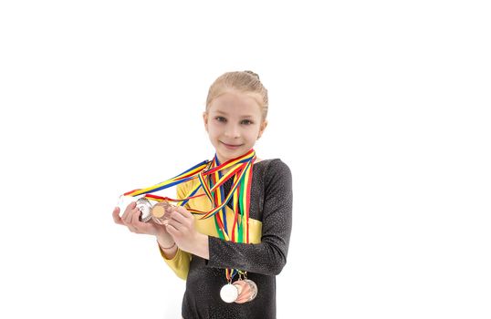 Young acrobatics girl portrait with many medal on neck isolated on white