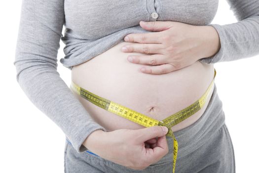 Closeup of pregnant woman at white background