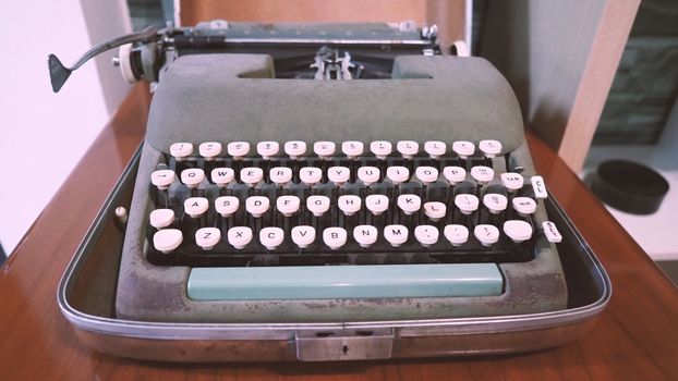 Old typewriter machine in good condition with no paper in feed for use in the past job career such as write office document, copywriter, author, news journalist, secretary, creative and more. 