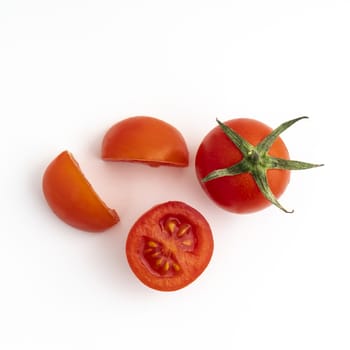 some small tomatoes on a white surface