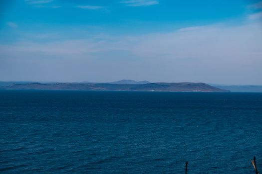 Sea view from the city of Vladivostok. Mountains on the other side of the sea.