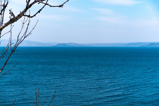 Sea view from the city of Vladivostok. Mountains on the other side of the sea.