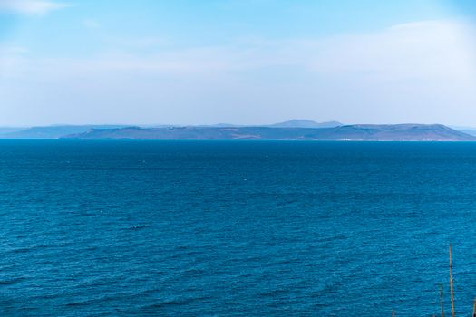 Sea view from the city of Vladivostok. Mountains on the other side of the sea.