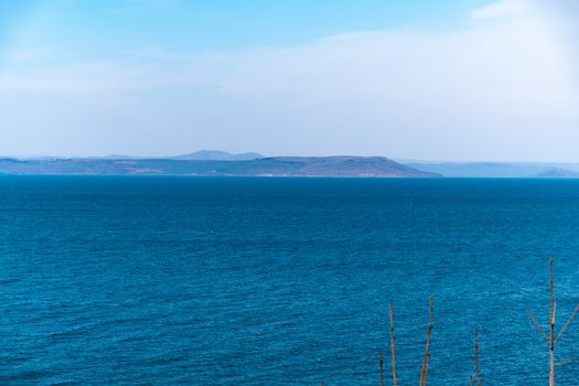 Sea view from the city of Vladivostok. Mountains on the other side of the sea.