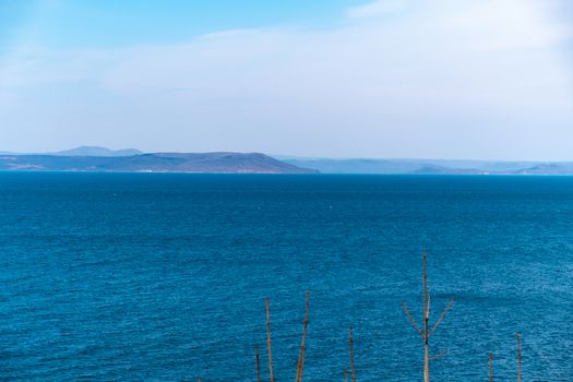 Sea view from the city of Vladivostok. Mountains on the other side of the sea.