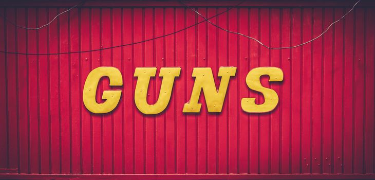 A Retro Red Gun Store Sign In The USA