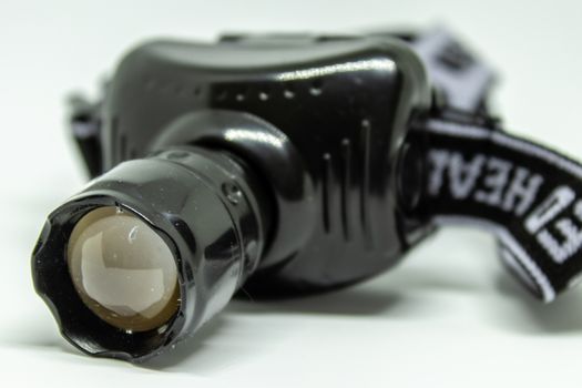 a closeup headlamp shoot with white background. photo has taken with photobox.
