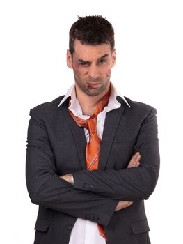 Close up of a businessman with bloody lip, beaten and bruised, isolated