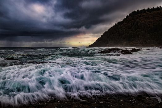 A stormy day at Thor's Well, central Oregon, USA. Color Image.