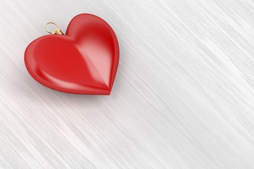 Heart shaped Christmas ball on wood background
