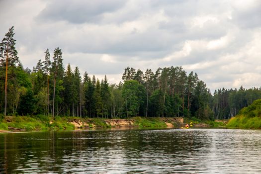 Landscape with cliff near the river Gauja, forest and sky. The Gauja is the longest river in Latvia, which is located only in the territory of Latvia. 

