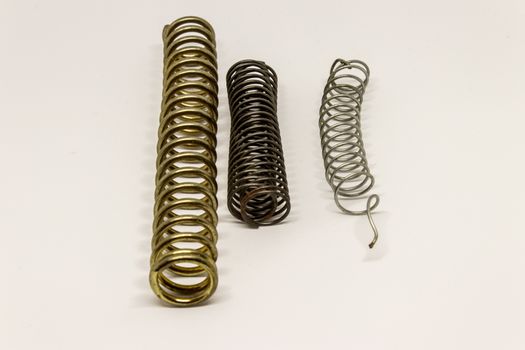 some scraps with soft light. there is some different sized metal springs.