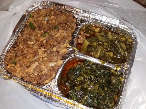 metal tray with Ethiopian food beef and tripe with greens and oil