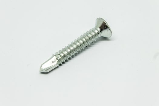 an isolated screw shoot with white background. closeup shoot with sharp details.
