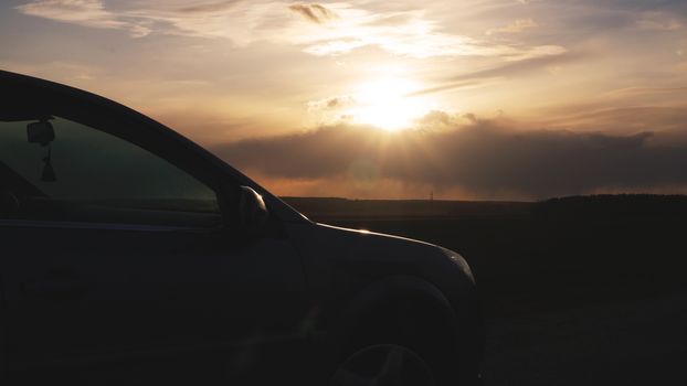 Car on highway with sunset landscape - Tourism concept