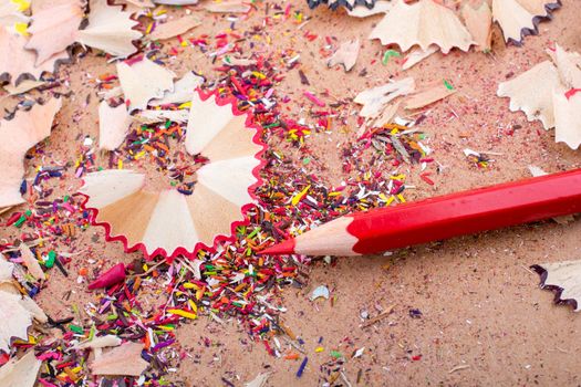 Red Color Pencil over some  pencil shavings