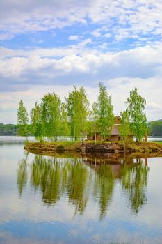 Small Island with a House among Birches in the Middle of the Daugava River, Latvia