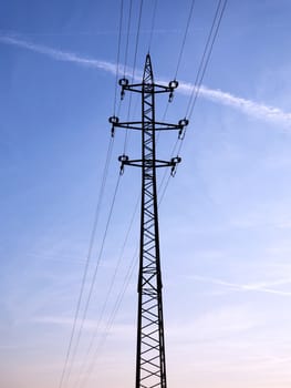 High-voltage lines and cables onthe blue sky background.