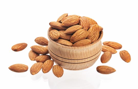 Almond nut in a wooden bowl isolated on a white background with clipping path