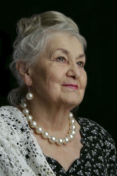 A very old woman. An eighty-year-old woman. Studio portrait of an old woman