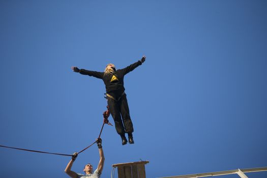Jumping from the bridge with a rope. RoupeJumping