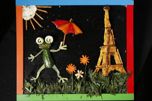 Symbols of France frog and tower.The Eiffel Tower made from food
