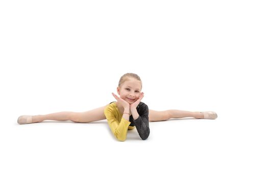 Acrobatics teenage girl sitting in cross split isolated on white