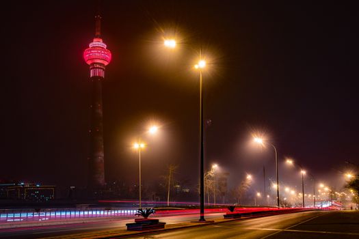 The Central Radio and Television Tower at night with colorful illumination, Beijing, China.