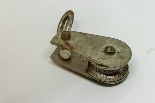 an old rusty connection tool closeup. product shoot with white background.