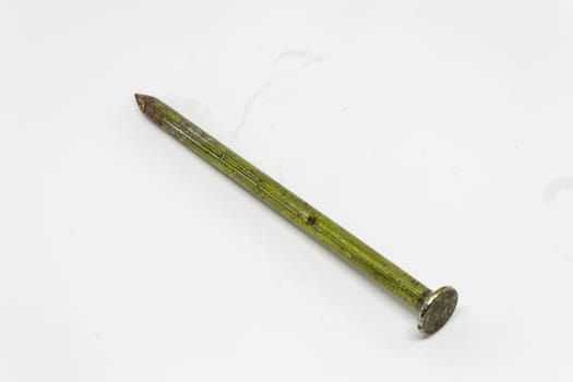 an old rusty nail closeup with white background. detailed product shoot.