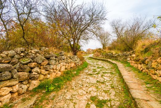 Road in the empty cave town of Chufut-Kale, landmark of the Crimea, Russia