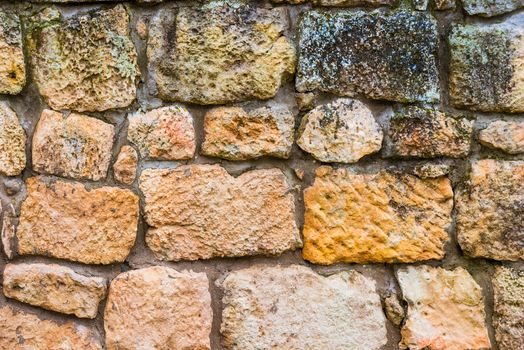 Natural background - large rough stone wall close-up