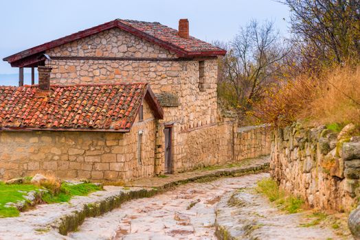 Stone houses and the road of the cave city of Chufut-Kale in the Crimea