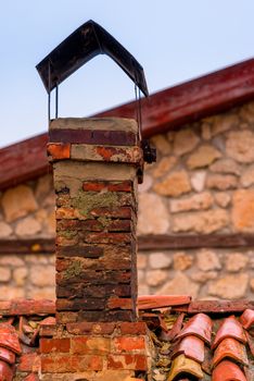 chimney on the roof of a rural house close up