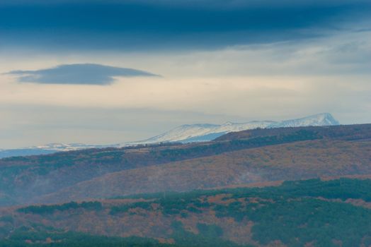 Autumn landscape - mountains, autumn forest on an overcast rainy day