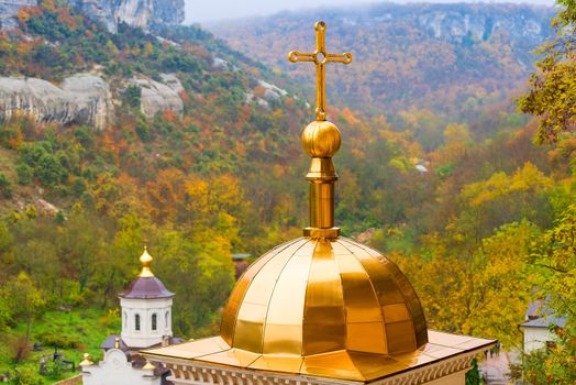 Close-up of a dome with a cross of an Orthodox church