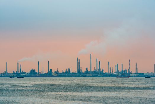 Oil refinery at sunset on Bukom Island in Singapore