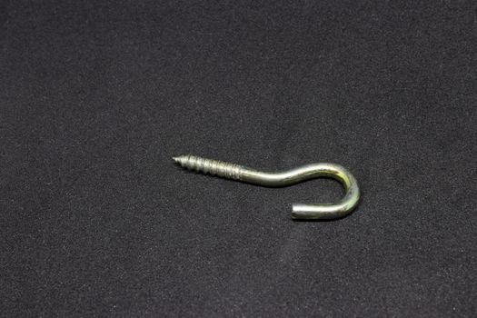 some isolated curved metal screw closeup shoot. photo has taken with photobox with black background.