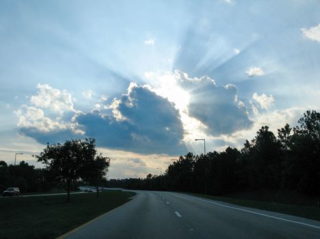 Rays of sunshine coming out of a cloud