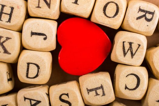 Red Love icon and Letter cubes of made of wood