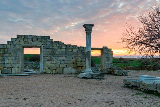 ancient Chersonese at sunset near the Black Sea, beautiful ruins on the background of the red sky