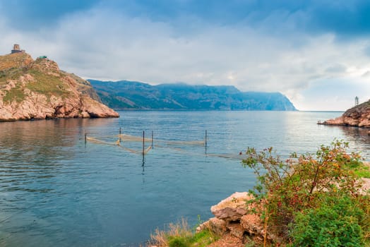 Mountains and the sea scenic landscape, dramatic sky above the sea