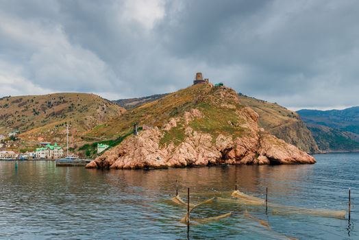 dramatic and gloomy sky over picturesque mountains and Balaklava Bay in Crimea, Russia