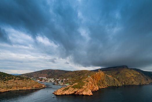 Heavy rain clouds over the bay, sea landscape