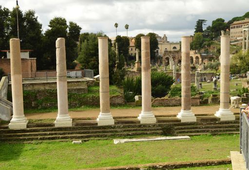 View of the Roman Forum in Rome, Italy. The Roman forum is one of the main tourist destinations in Europe. Beautiful panorama of the Roman Forum in summer. Ancient ruins in the center of Rome.