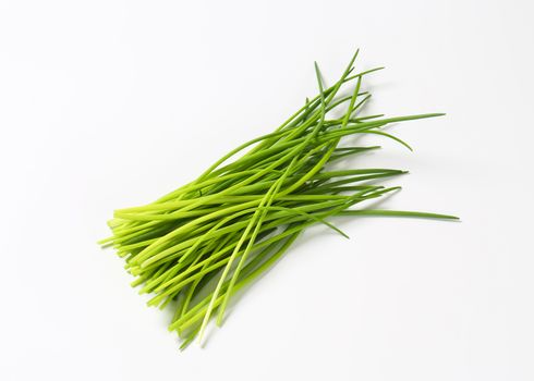 Fresh chives leaves on white background