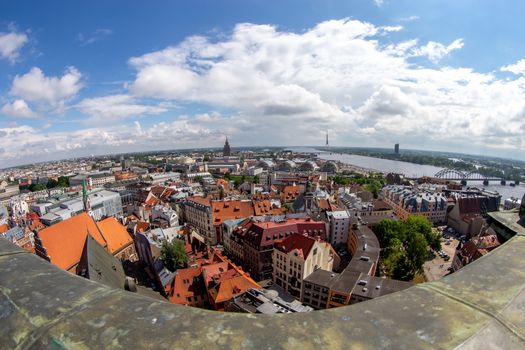 Fisheye aerial view of Riga city from st. Peter's church in Latvia. Panoramic view of Riga with cloudy blue sky. Fisheye lens.