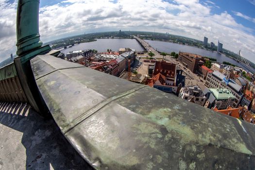 Fisheye aerial view of Riga city from st. Peter's church in Latvia. Panoramic view of Riga with cloudy blue sky. Fisheye lens.